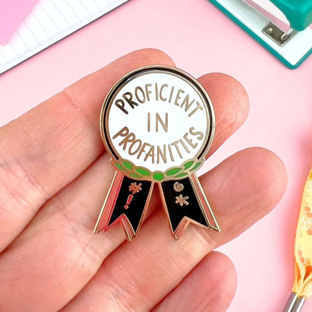 Jubly_Umph_Proficient_in_profanities_lapel_pin_on_hand