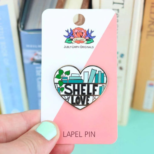 Jubly_Umph_Shelf_Love_Lapel_pin_in_persons_hand
