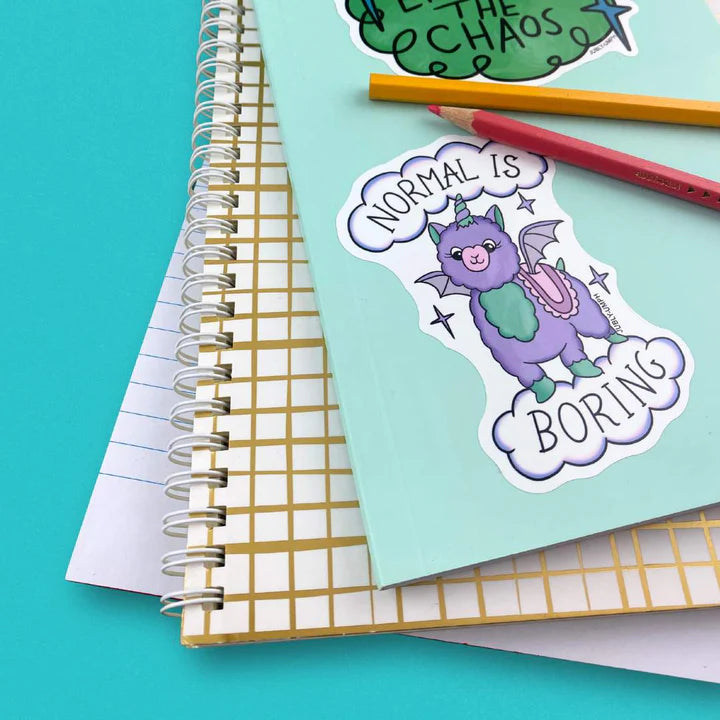 Jubly_Umph_Sticker_normal-is-boring_on_book