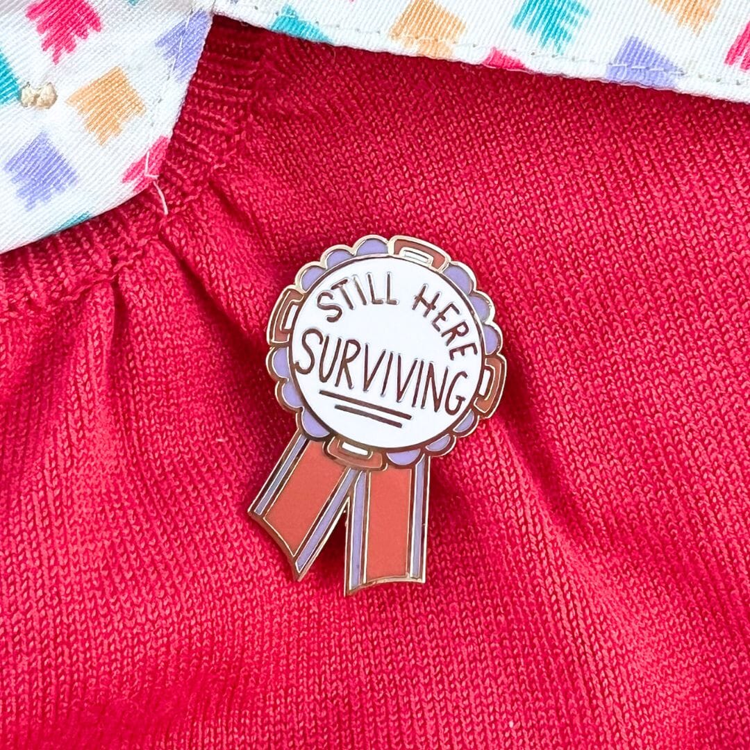 Jubly_Umph_Still_here_surviving_lapel_pin_on_jumper
