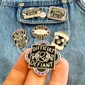 Collection of vintage-style pins with text and graphics on a white background