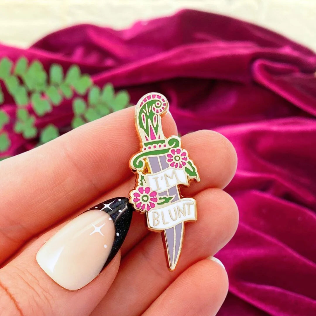 Jubly_Umph_im_blunt_lapel_pin_in_hand