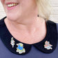 ubly_Umph_im_blunt_lapel_pin_lady_wearing