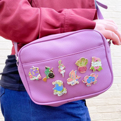 Jubly_Umph_im_blunt_lapel_pin_on_bag