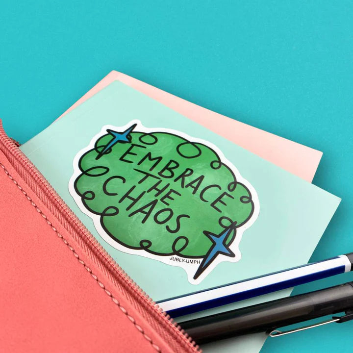 Jubly_Umph_sticker_Embrace-the-chaos_on_book