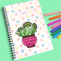Notebook with a cactus illustration on a colorful background