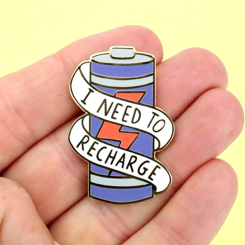 Jubly_umph_Pin_I_need_to_recharge_2023_on_persons_hand