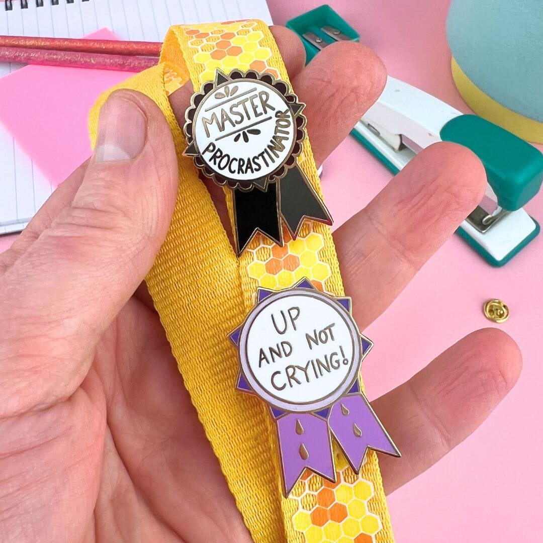 Jubly_umph_Up_And_Not_Crying_Lapel_Pin_on_strap