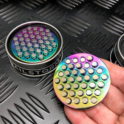 Kaiko_Hailstorm_metal_fidget_oil_slick_in_persons_hand.