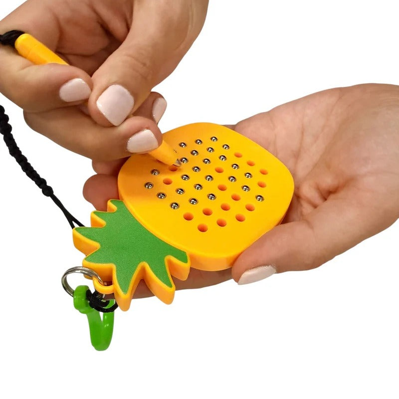 Kaiko_Pineapple_magnetic_pad_keyring_in_use_1