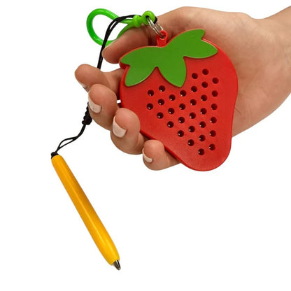 Kaiko_Strawberry_magnetic_pad_keyring_in_hand