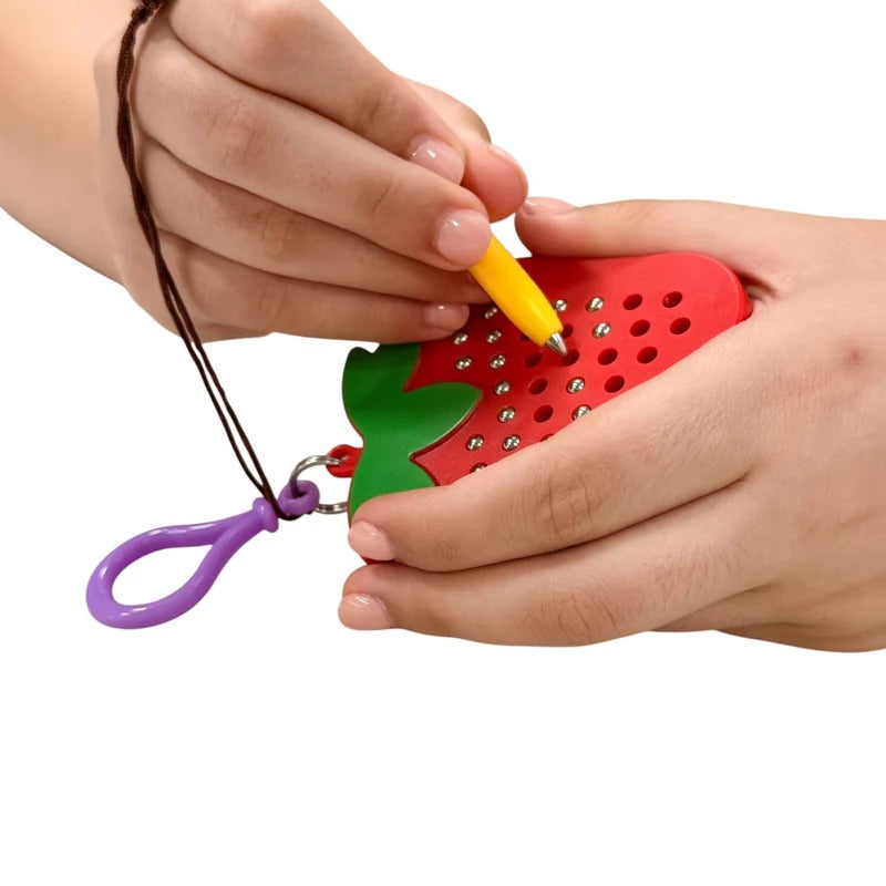 Kaiko_Strawberry_magnetic_pad_keyring_in_use