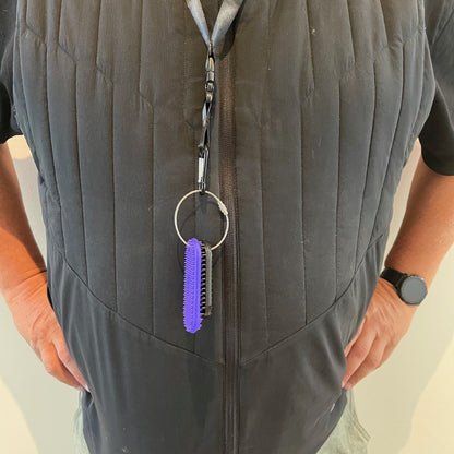 Kaiko_fidgets_Spikeyring_on_lanyard.