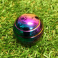 Kaiko_fidgets_gyroscope_oil_slick_on_grass