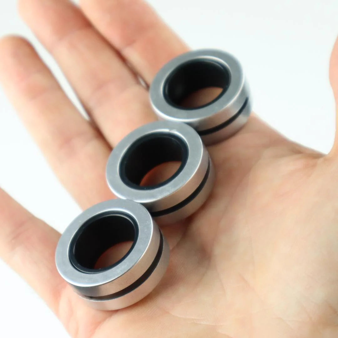 Kaiko_fidgets_metail_rings_in_a_line