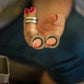 Kaiko_fidgets_metail_rings_on_persons_fingers