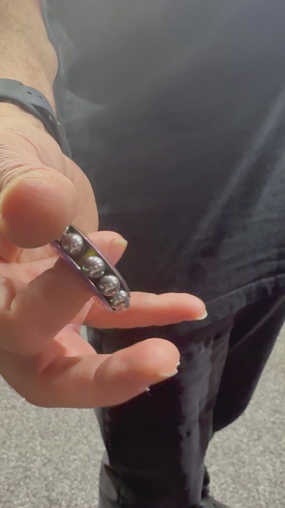 Freewheel Spinner – Oil Slick Metal Sensory Tool by Kaiko