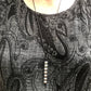 Kaiko_silk_worm_necklace_on_persons_neck
