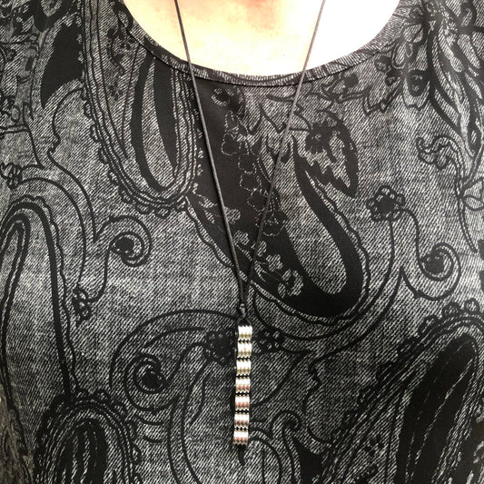 Kaiko_silk_worm_necklace_on_persons_neck