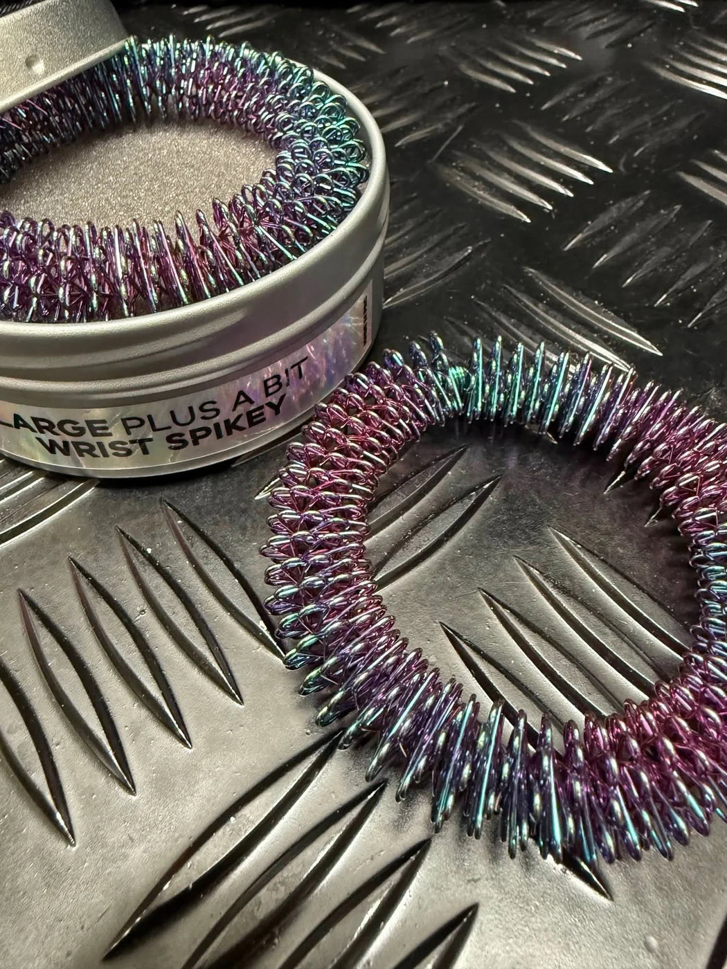 Kaiko_wrist_spikey_oil_slick_self_harm_tool_large_plus_a_bit