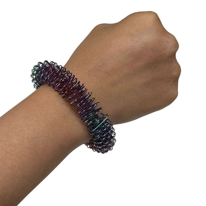 Kaiko_wrist_spikey_oil_slick_self_harm_tool_on_wrist