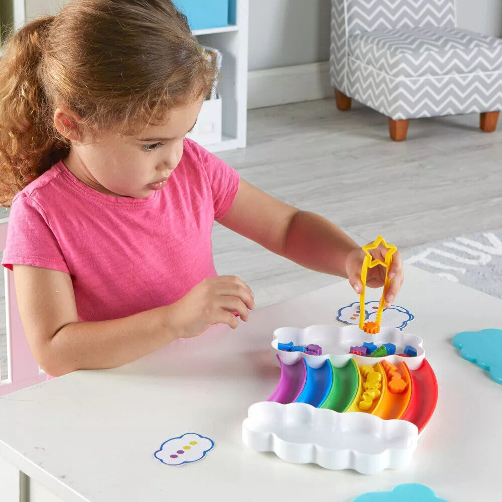 Learning_Resources_Rainbow_sorting_Set_Girl_using_tweezers_to_move_pieces