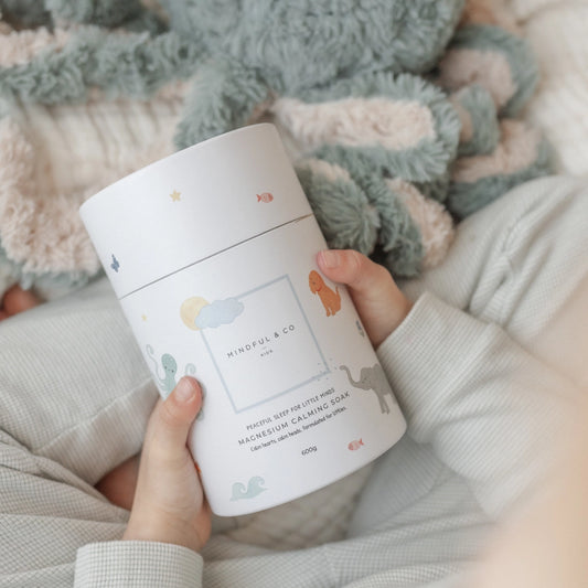 Mindful_and_Co_Kids_Calming_soak__child_holding_container