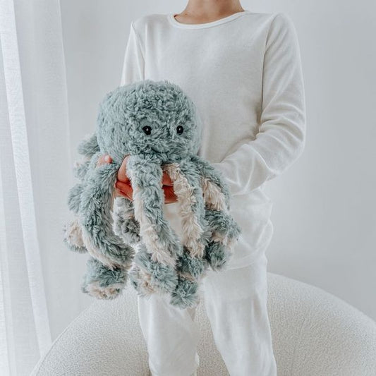 Mindful_and_Co_Kids_Calming_weighted_Animal_buddie_Ollie_the_Weighted_Octopus_being_held