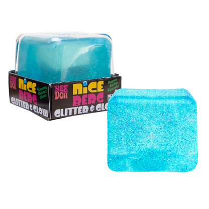 A bright blue glitter cube shown next to its retail box on a plain white background. The box has 'Nice Berg Glitter & Glow' branding.