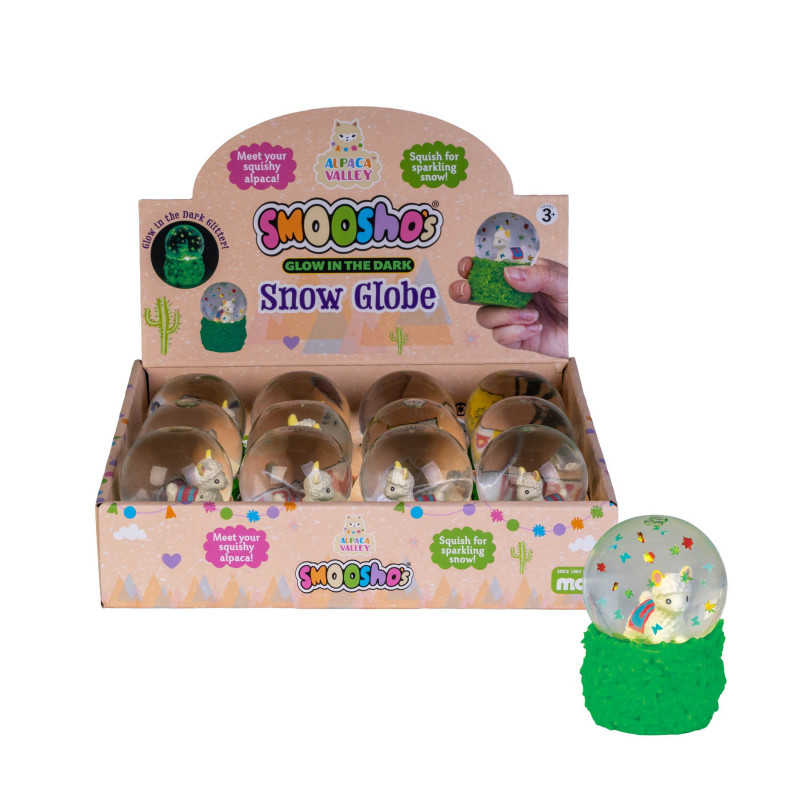 A display box of Smoooshos Glow in the Dark Snow Globe toys with several small clear globes inside, plus one larger unopened snow globe on a green base shown in front on a white background. Smooshos_alpaca_snow_dome_squishiy_packaging