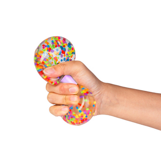 Hand holding a colorful stress ball against a white background. Smooshos_dumbell_in_hand