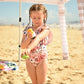 Solar_buddies_child_at_beach_applying_sun_cream_to_her_arm