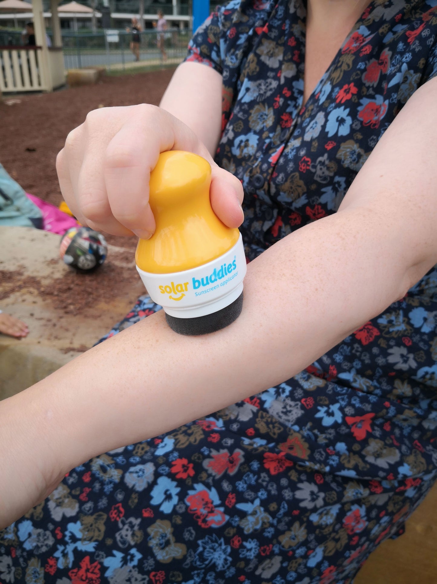 Solar_buddies_lady_applying_sun_cream_to_her_arm