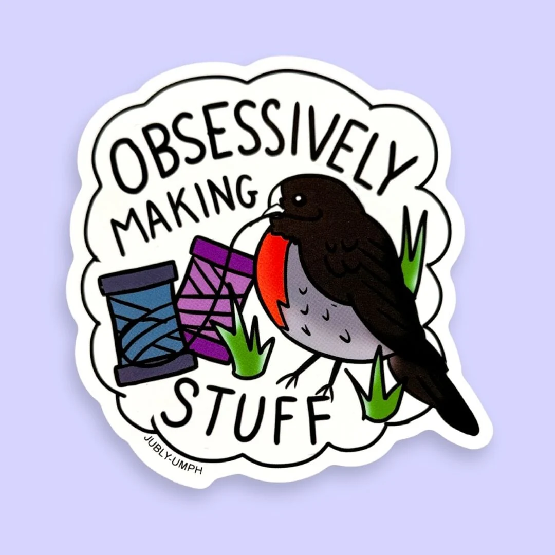 Sticker with a bird and text 'Obsessively Making Stuff' on a light purple background. Jubly_Umph