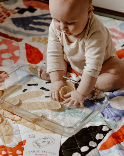 The_play_card_The_sit_up_champion_6-12months._baby_hands_in_water