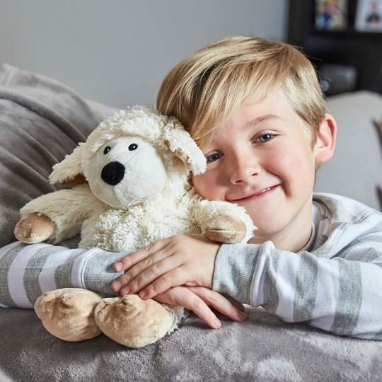 WARMIES_boy_snuggling_sheep