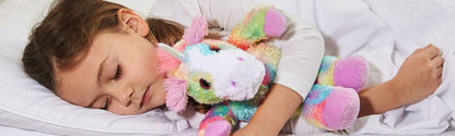 Warmies_Rainbow_unicorn_with_girl_sleeping