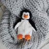 Warmies_penguin_on_rug