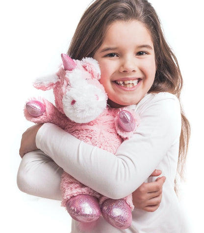 Warmies_pink_unicorn_being_cuddled_by_young_girl
