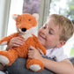 Warmies_red_fox_sitting_with_child