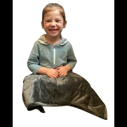 Child wearing a light blue hoodie and dark gray fleece blanket on a white background. Weighted_Lap_Pad_soft_grey_elizabeth_richards_child