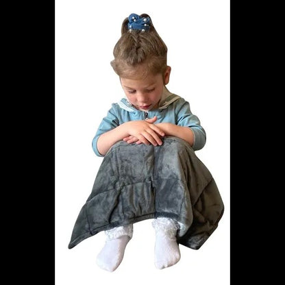 Child wearing a gray blanket over their shoulders on a white background. Weighted_Lap_Pad_soft_grey_elizabeth_richards_girl