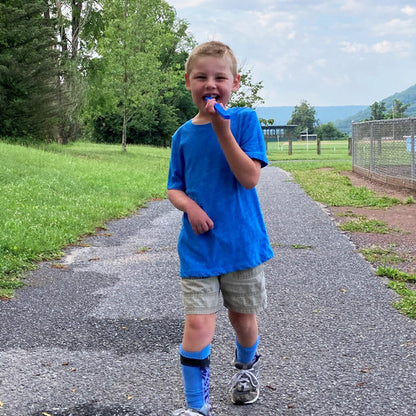 arks_mega_brick_stick_chew_young_boy_walking_and_chewing