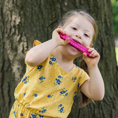 arks_mega_brick_stick_chews_girl_chewing