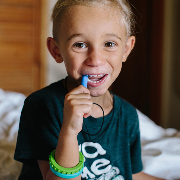 ARK's_Bite_Saber_Chew_boy_chewing_blue_chew