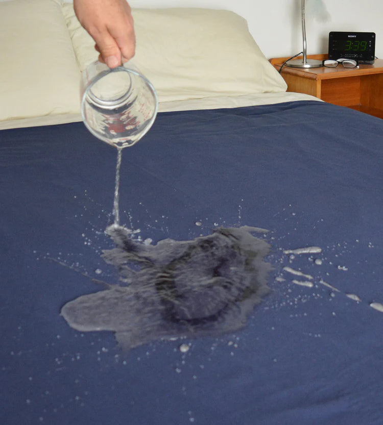 Brolly_Waterproof_fitted_sheets_water_being_poured_onto_bed