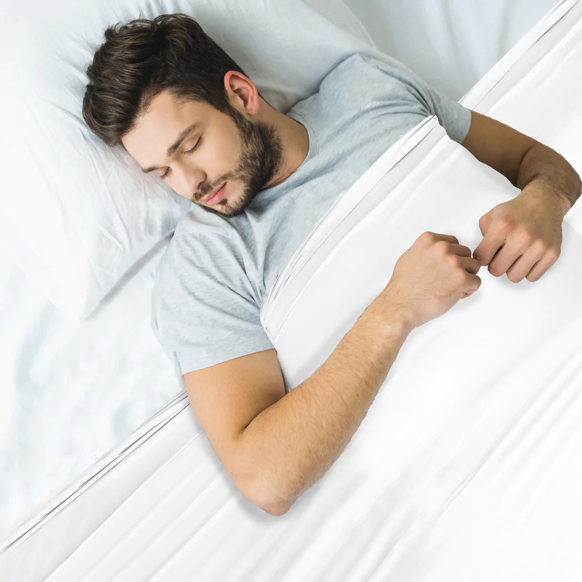 Man_asleep_in_Calmcare_white_Sensory_Compression_Bed_Sheet