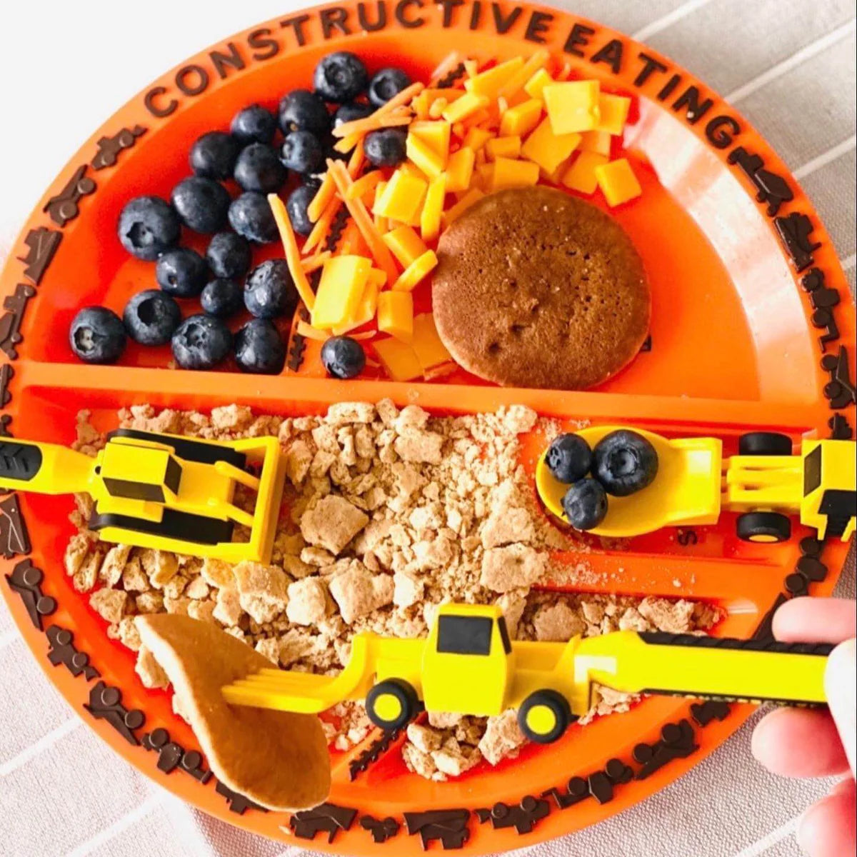 Construction_plate_with_food_and_cutlery_on_top