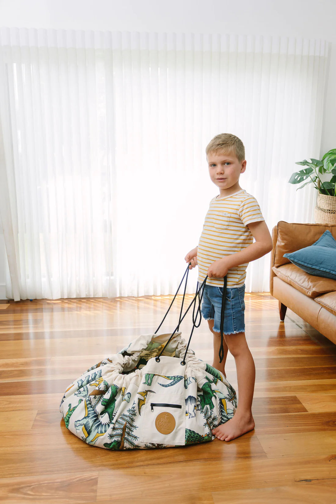 Play_pouch_Large_Dino_Roar_Boy_with_drawstring_pulled_and_all_his_toys_easily_put_away