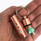 Flare_Storage_Capsule_rose_gold_in_persons_hand_woth_the_lid_off_and_flares_showing_inside